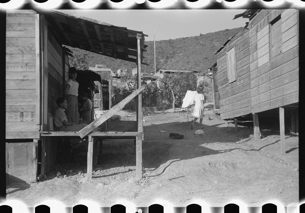 [Untitled photo, possibly related to: Street in slum area in Ponce, Puerto Rico. The land on which the houses stand rented…
