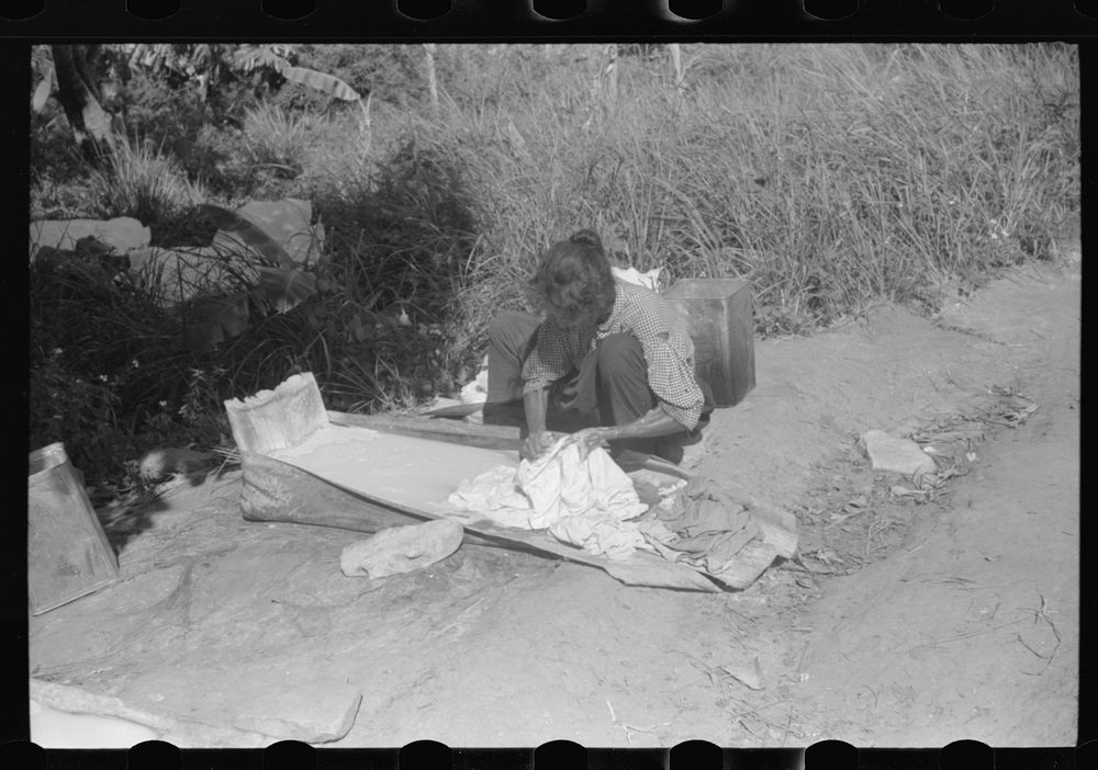 Using palm leaf as a wash tub on a farm near Manati, Puerto Rico. Sourced from the Library of Congress.