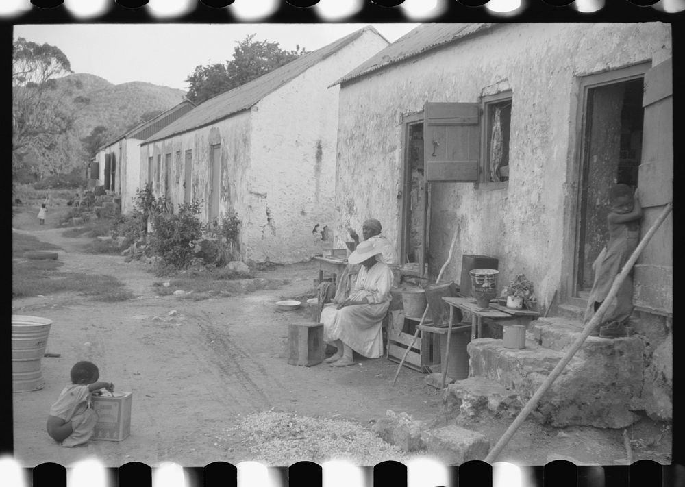 [Untitled photo, possibly related to: Old slave quarters still being used in one of the slum "villages," St. Croix, Virgin…