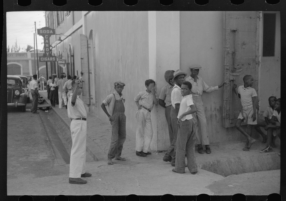 [Untitled photo, possibly related to: Boys playing on a street corner in Charlotte Amalie, Virgin Islands]. Sourced from the…