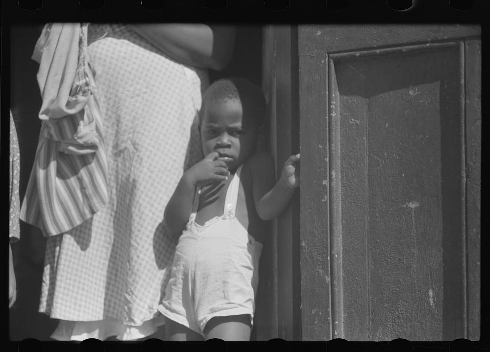 [Untitled photo, possibly related to: Charlotte Amalie, St. Thomas Island, Virgin Islands. Family living in a slum area].…