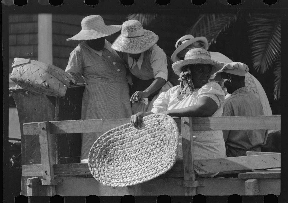 Boarding a truck to go home from a day's shopping in Christiansted, Virgin Islands. Sourced from the Library of Congress.