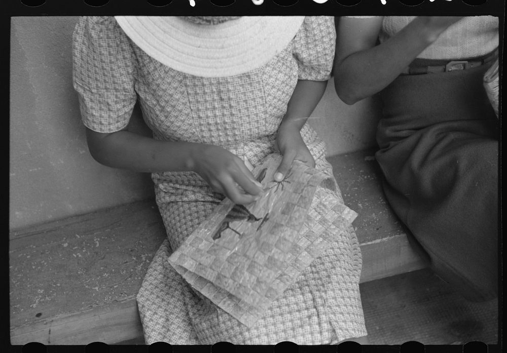 Charlotte Amalie, St. Thomas Island, Virgin Islands. Embroidering a handbag at the handicrafts cooperative. Sourced from the…