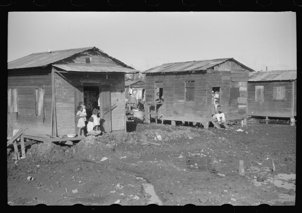 Houses in the slum area known as "El Fangitto" (The Mud) in San Juan, Puerto Rico. Sourced from the Library of Congress.