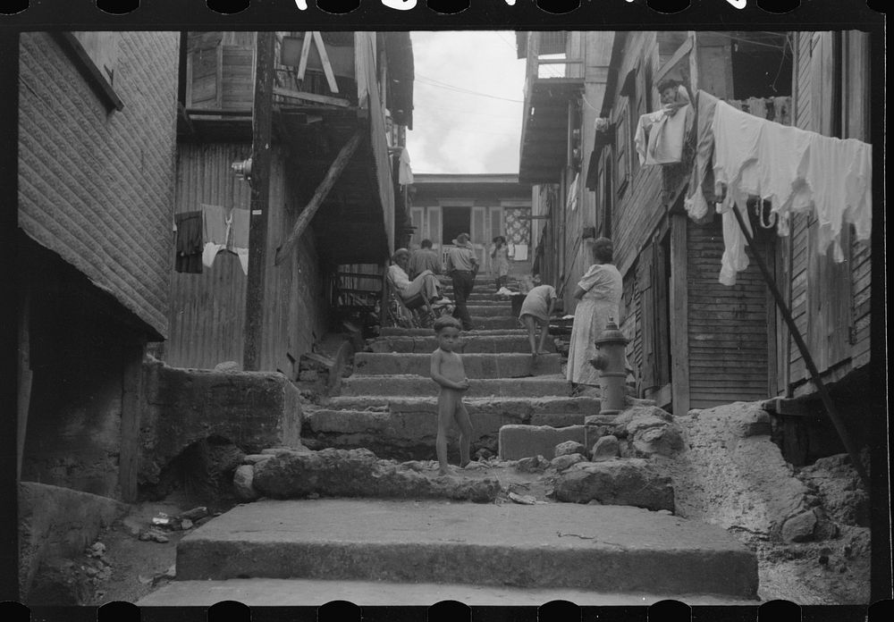 [Untitled photo, possibly related to: A street in the slum area of the hill town of Lares, Puerto Rico]. Sourced from the…