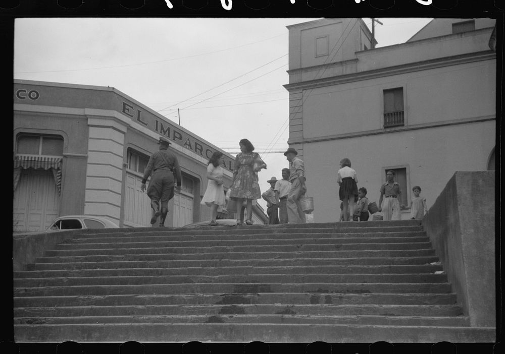 [Untitled photo, possibly related to: San Juan, Puerto Rico. People carrying water home because of the failure of the water…