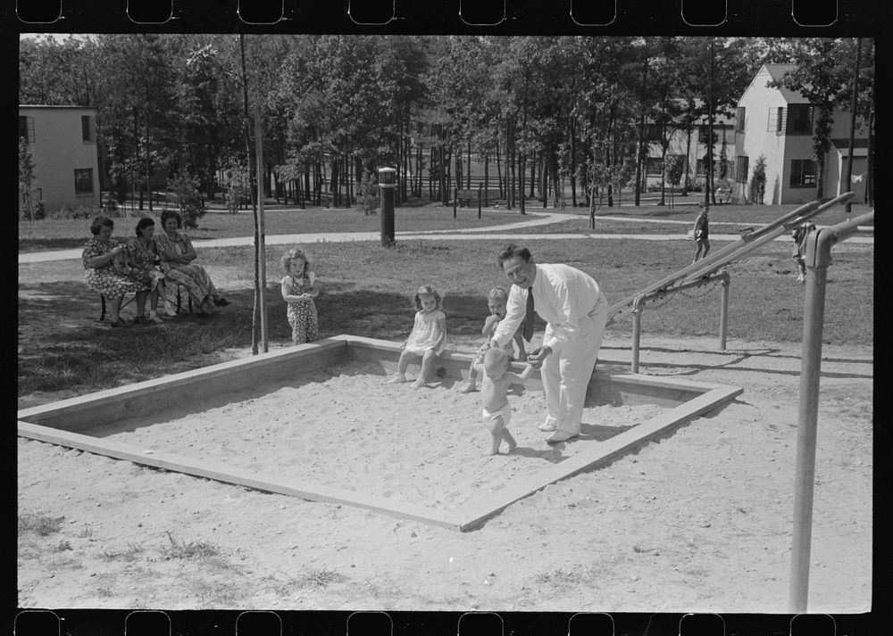 [Untitled photo, possibly related to: Father and son at Greenbelt, Maryland]. Sourced from the Library of Congress.