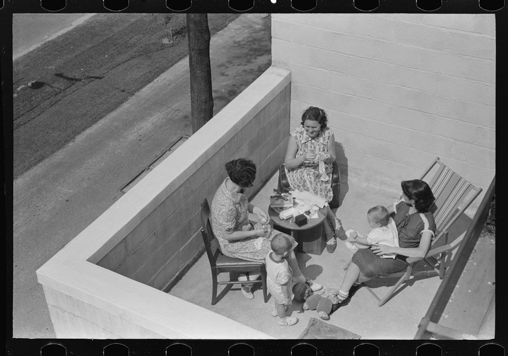 Family on terrace in Greenbelt home, Naryland. Sourced from the Library of Congress.