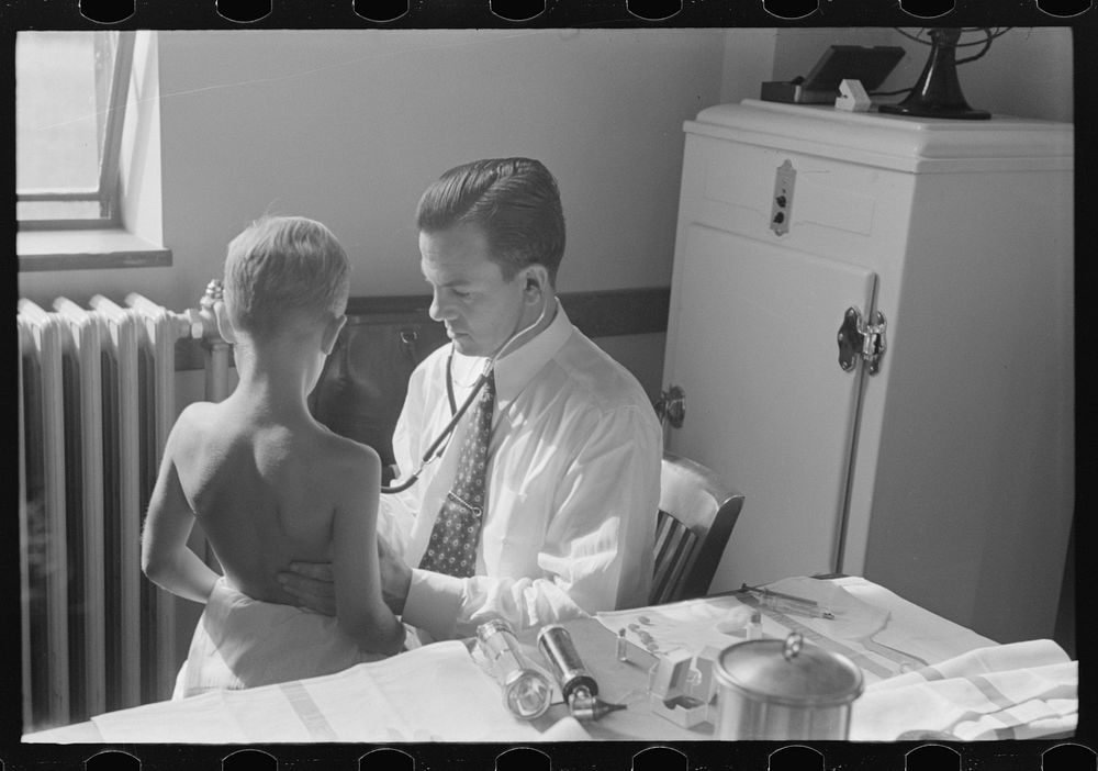 Doctor examining child at preschool clinic. Greenbelt, Maryland. Sourced from the Library of Congress.