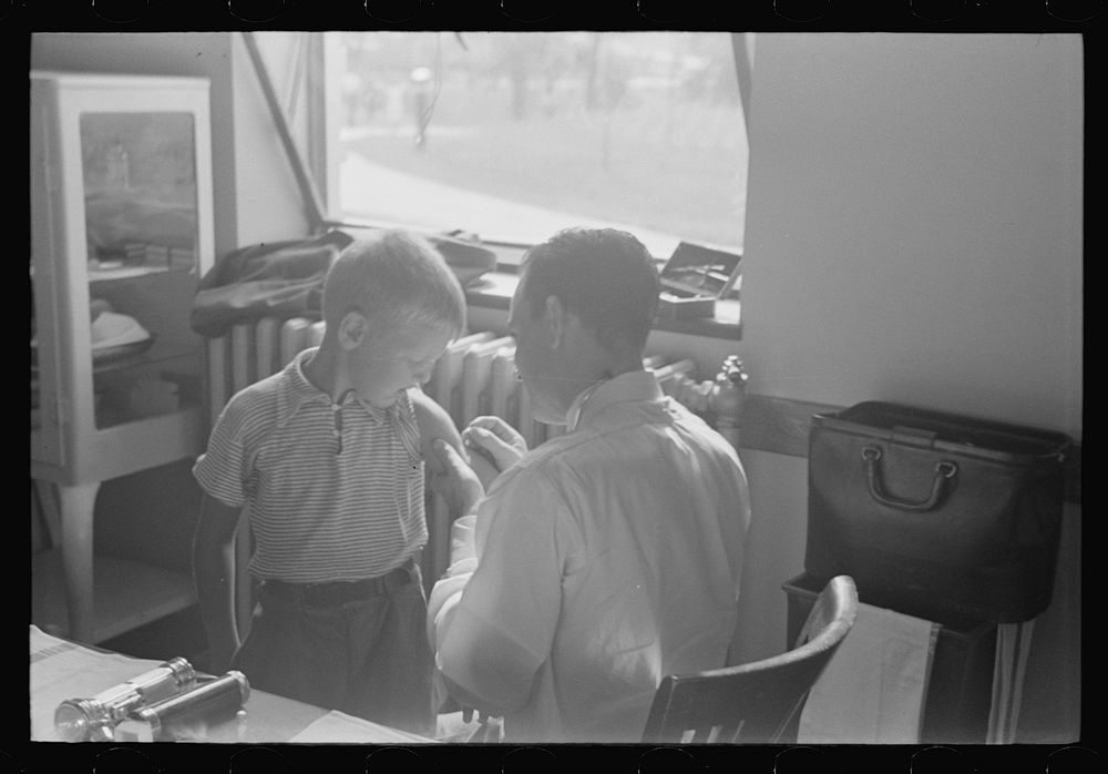 [Untitled photo, possibly related to: Doctor examining child at Greenbelt in preschool clinic, Maryland]. Sourced from the…