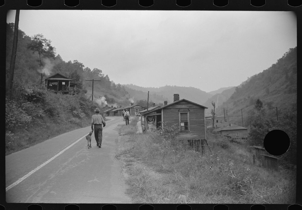 [Untitled photo, possibly related to: Carrying water to one of the houses in abandoned mining community, Marine, West…