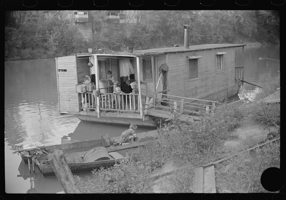 [Untitled photo, possibly related to: Child on back porch of his home, riverboat house in Charleston, West Virginia].…
