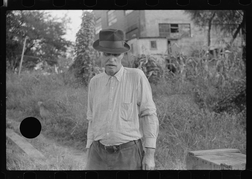 [Untitled photo, possibly related to: Man living in shack by river, Charleston, West Virginia]. Sourced from the Library of…