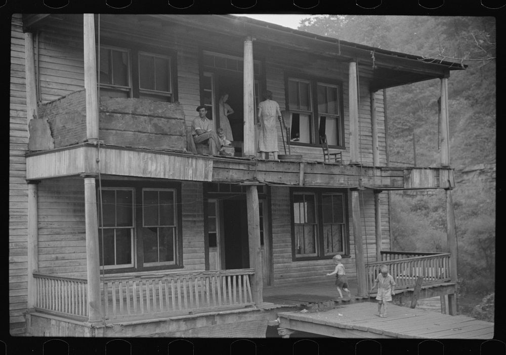 Former miners' boardinghouse now inhabited by seven families, almost all on relief in abandoned mining town, Mohegan, West…