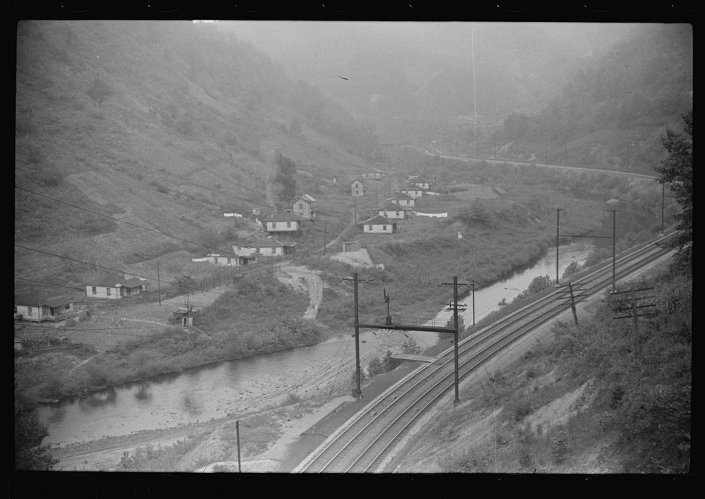 [Untitled photo, possibly related to: Houses in abandoned mining town with remains of coal tipple at right, Mohegan, West…