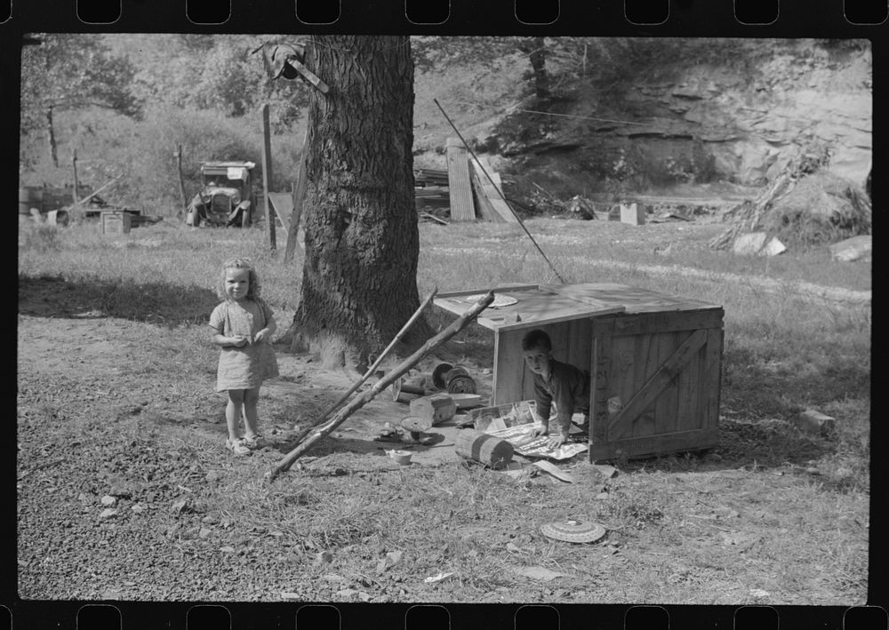 WPA (Works Progress Administration) worker's children with their toys in their play yard. South Charleston, West Virginia.…