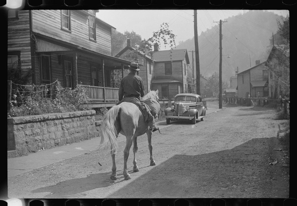 Miner taking home provisions, Caples, West Virginia. Sourced from the Library of Congress.