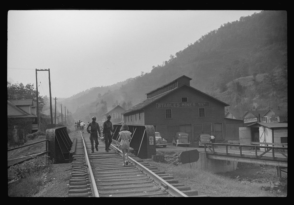 Coal miners returning to and from work and children going from school along tracks, Omar, West Virginia. Sourced from the…