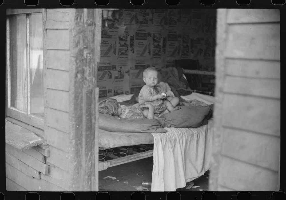 Children in bedroom of their home. Mother has TB, father is on WPA (Works Progress Administration), Charleston, West…