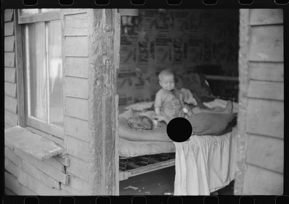 [Untitled photo, possibly related to: Children in bedroom of their home. Mother has TB, father is on WPA (Works Progress…