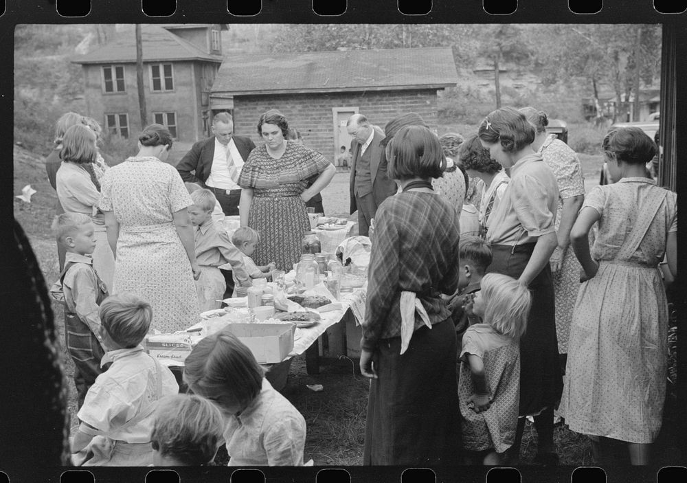 Prayer, or grace, at Sunday school picnic in abandoned mining town of Jere, West Virginia. Sourced from the Library of…