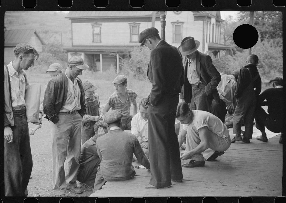 [Untitled photo, possibly related to: Coal miners card gambling Saturday afternoon on porch of company store, Chaplin, West…