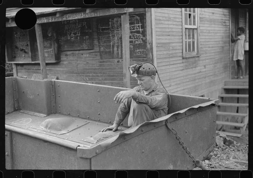 [Untitled photo, possibly related to: Coal miner waiting for car to go in on next trip, Maidsville, West Virginia]. Sourced…