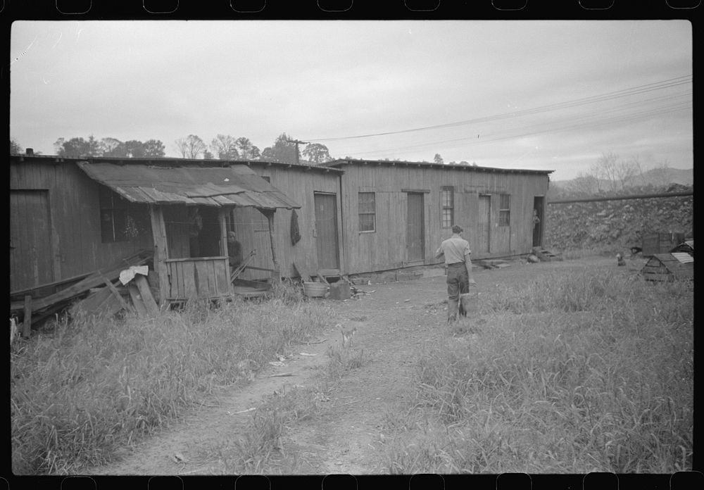 Carrying water, coal miners shacks. Scotts Run, West Virginia. Sourced from the Library of Congress.