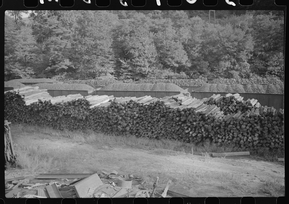 Wood pile for use in mine and coal cars, Scotts Run, West Virginia. Sourced from the Library of Congress.