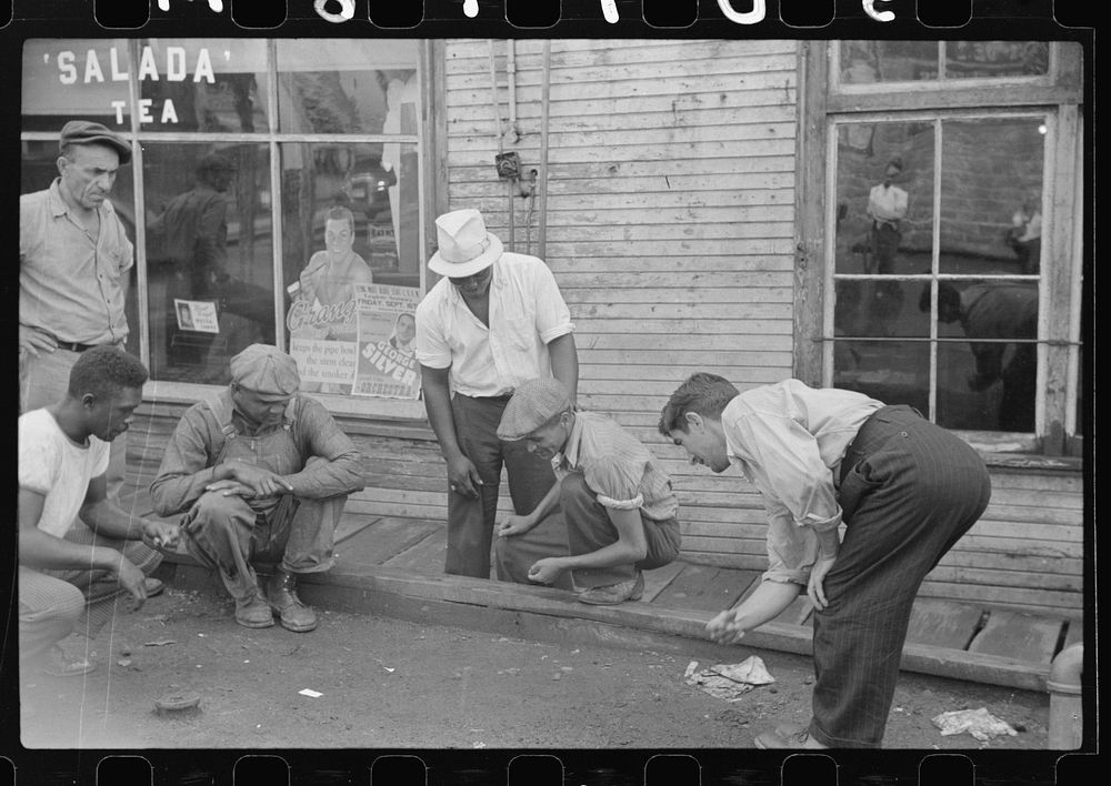 [Untitled photo, possibly related to: Shooting craps by company store, Osage, West Virginia]. Sourced from the Library of…
