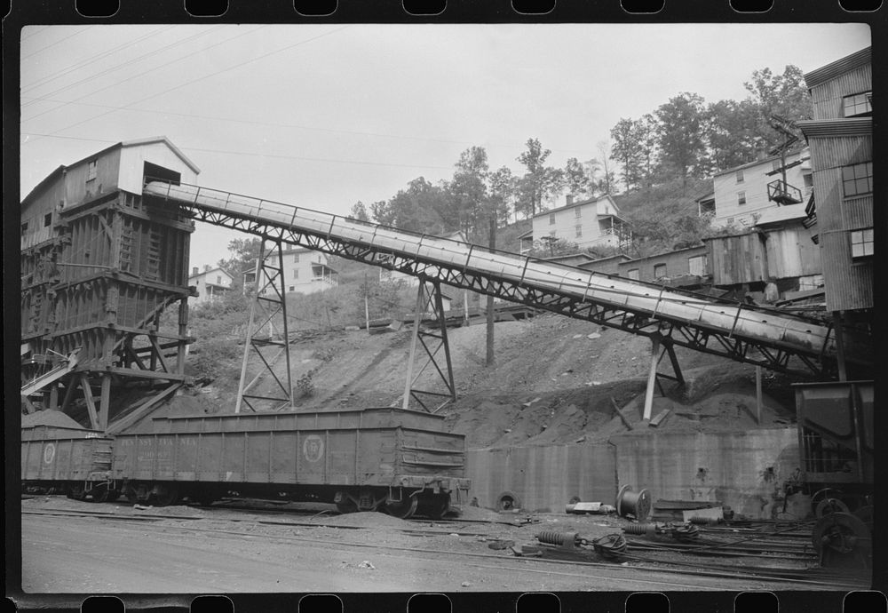 Part of coal mine tipple with workers' homes in background. Pursglove Cleaning Plant No. 2, West Virginia. Sourced from the…