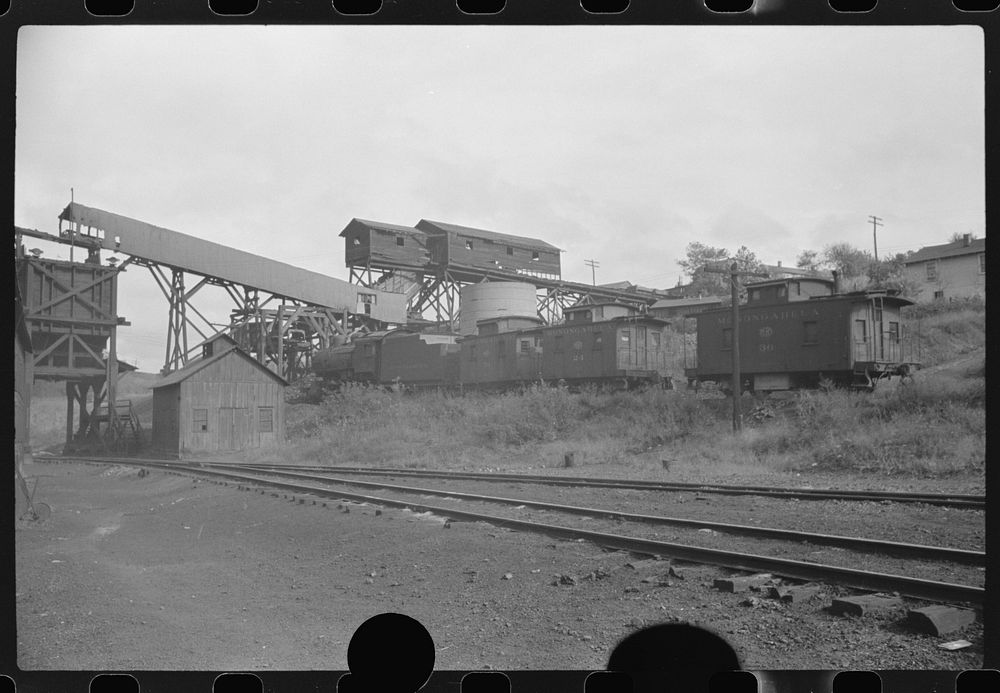 [Untitled photo, possibly related to: Part of coal mine tipple with workers' homes in background. Pursglove Cleaning Plant…