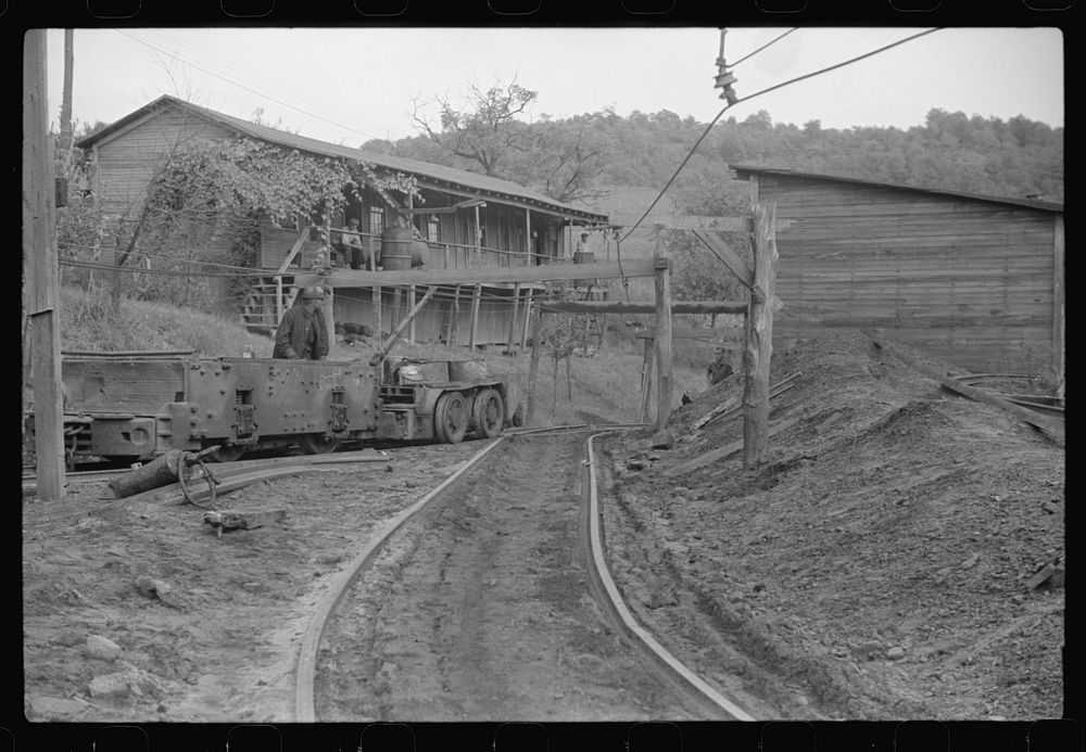 [Untitled photo, possibly related to: Coal miners switching motor. Note live wires. The "Patch," Chaplin, West Virginia].…
