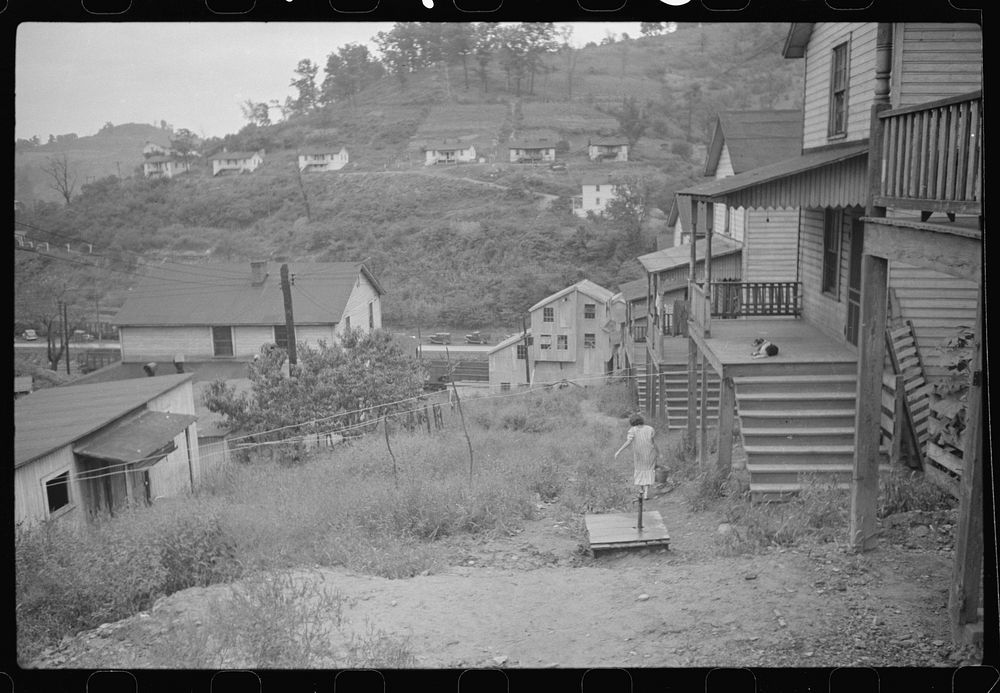[Untitled photo, possibly related to: Coal miner's wife getting water from pump, company houses, Pursglove, Scotts Run, West…