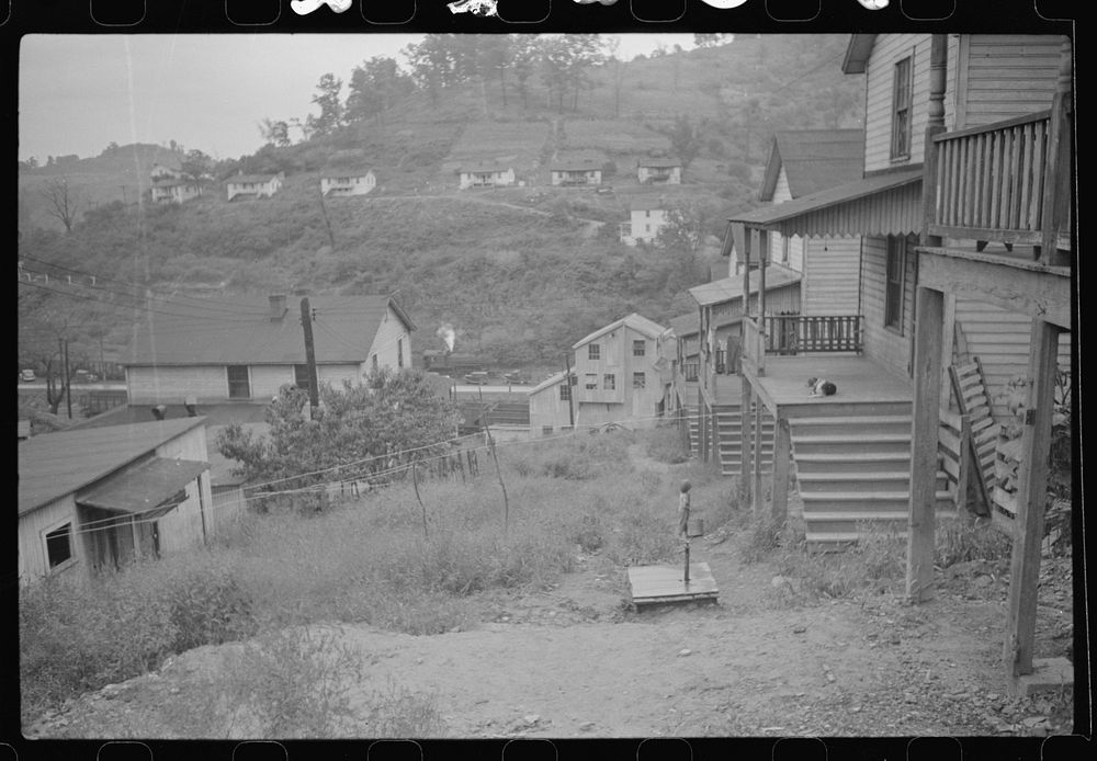 [Untitled photo, possibly related to: Coal miner's wife getting water from pump, company houses, Pursglove, Scotts Run, West…