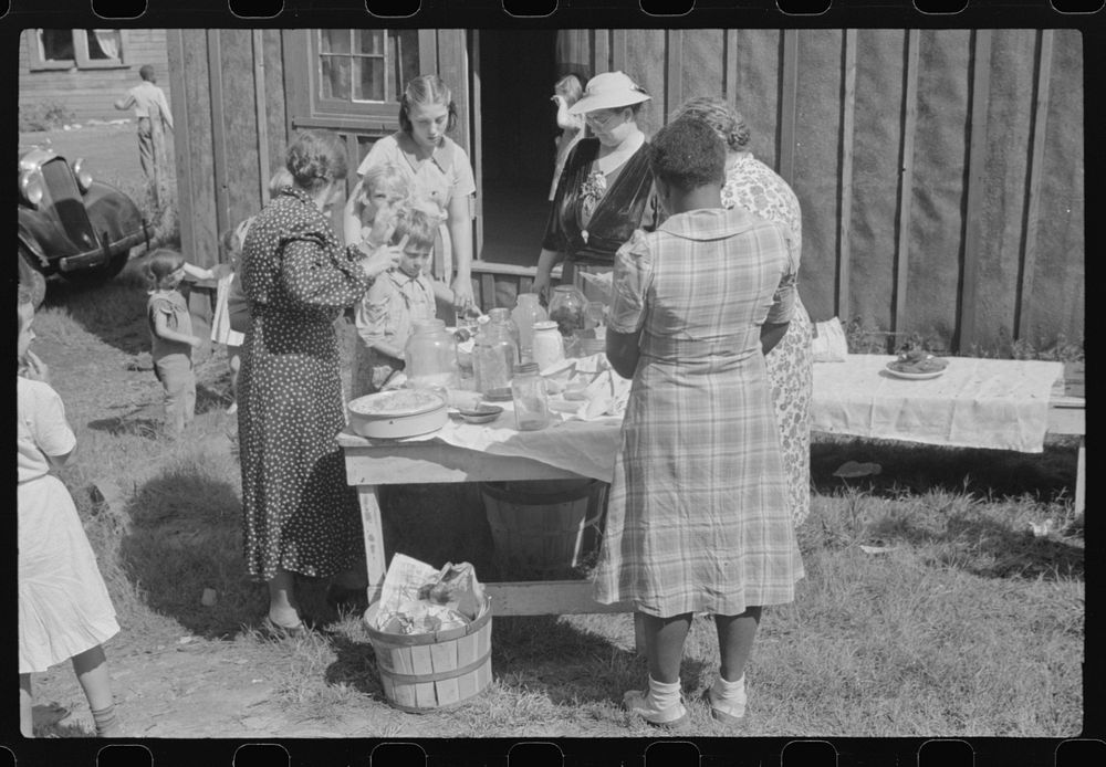 Sunday school picnic brought into abandoned mining town of Jere, West Virginia, by neighboring parishioners. Sourced from…