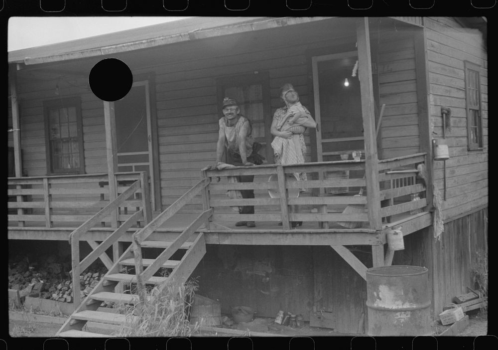 [Untitled photo, possibly related to: Coal miner, his wife and baby living in one of shanties seen in nos. 30144-M2 and…