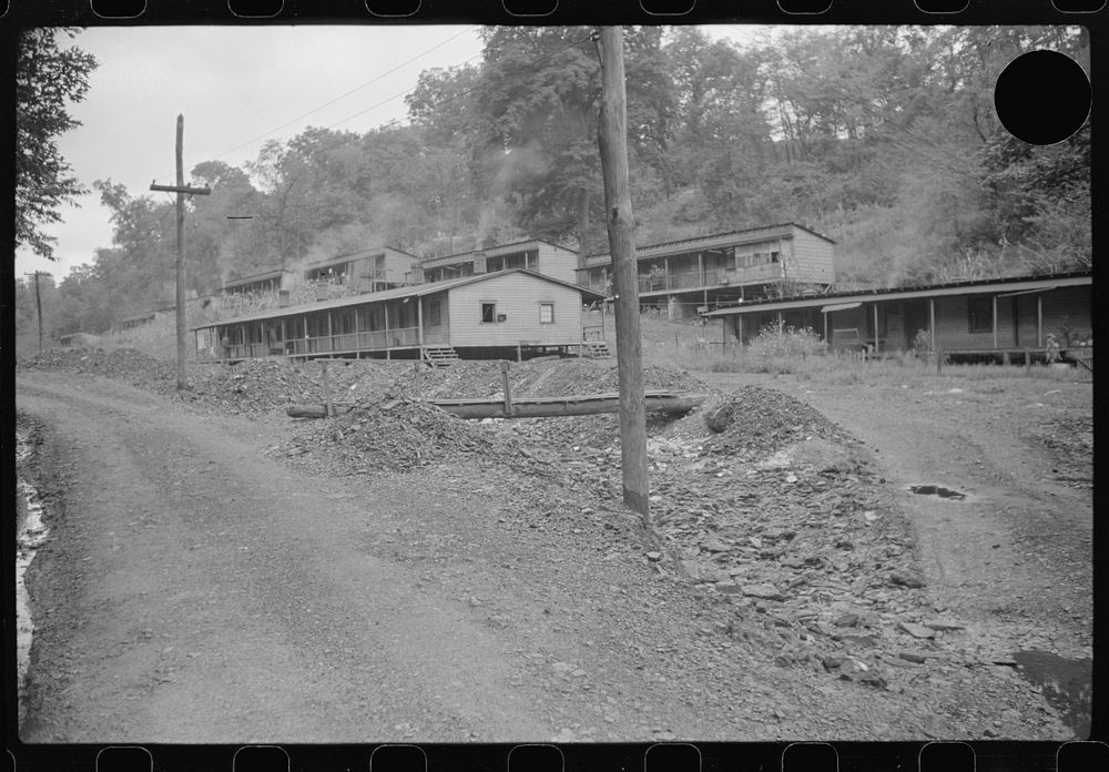 [Untitled photo, possibly related to: Coal miners' homes, company houses, with piles of slag and slate. "The Patch,"…
