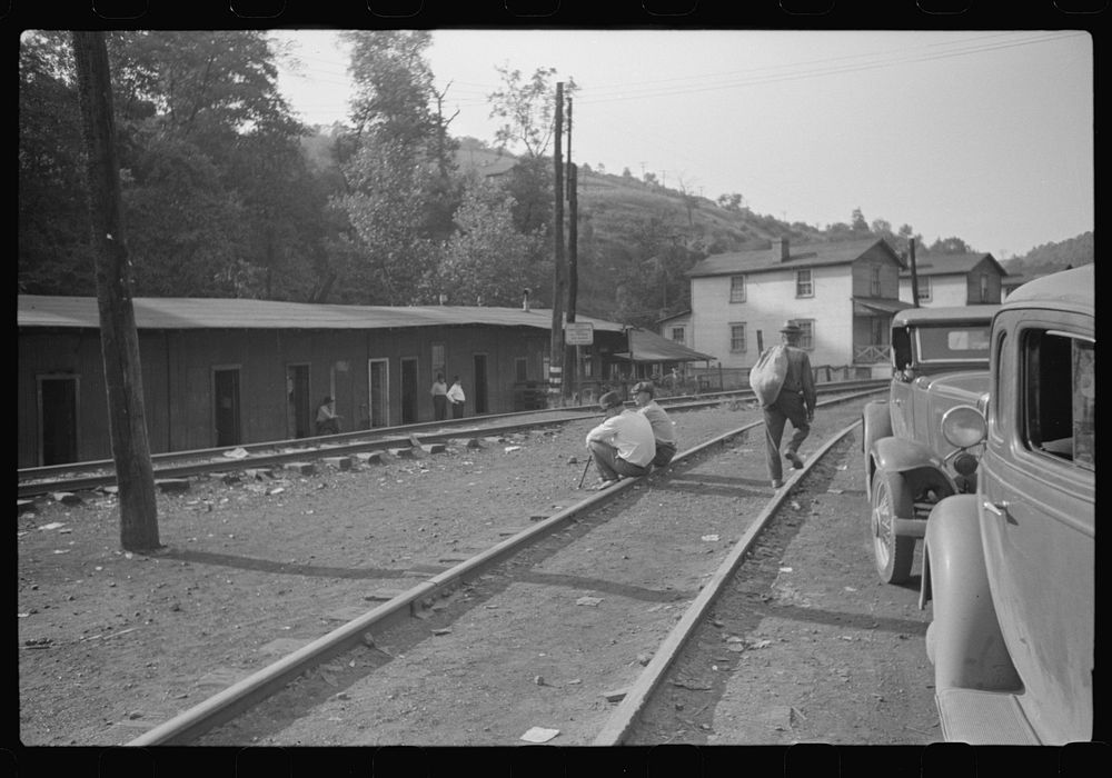 Along main highway, center of mining town, miner's shacks in left background, Osage, West Virginia. Sourced from the Library…