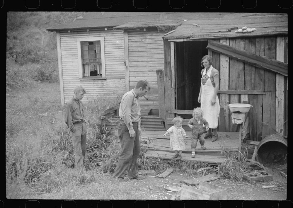 [Untitled photo, possibly related to: Coal miner and some of his family in back of their home. Bertha Hill, West Virginia].…