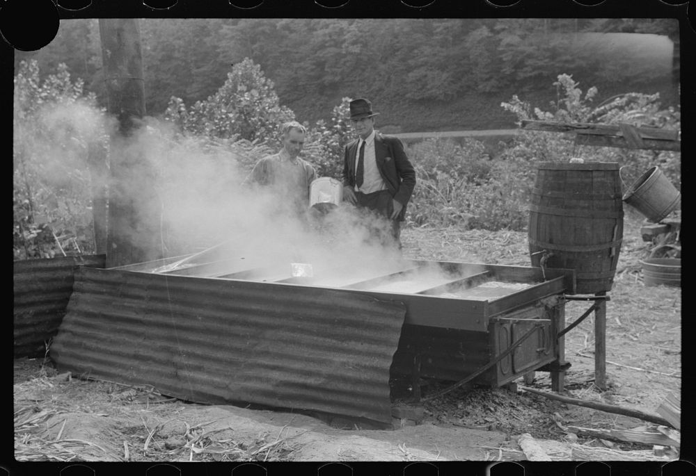 [Untitled photo, possibly related to: Racine, West Virginia. Making molasses is hot work]. Sourced from the Library of…