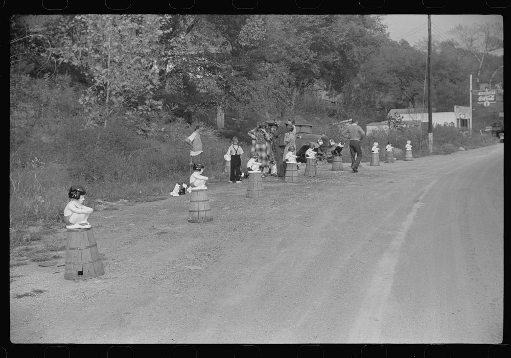 Kewpie dolls bathing girls for sale along main highway near Charleston, West Virginia. Sourced from the Library of Congress.