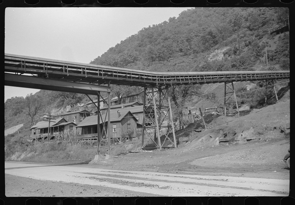 Part of tipple with laborers' homes in back, Longacre, West Virginia. Sourced from the Library of Congress.