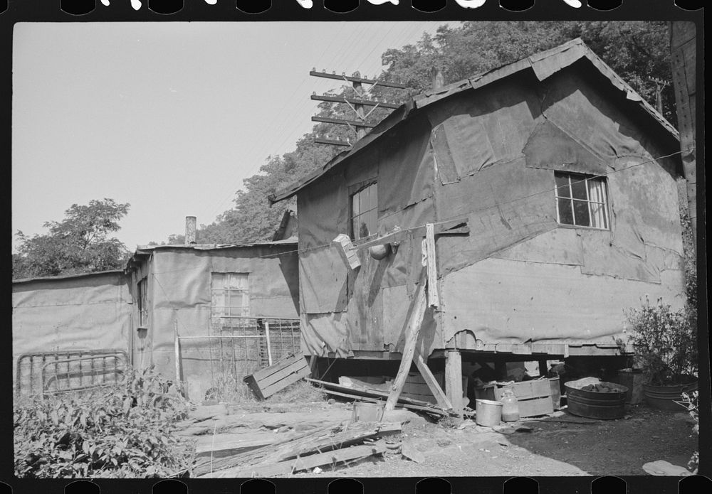 Shacks inhabited by es along river on highway between Charleston and Gauley Bridge, West Virginia. Sourced from the Library…