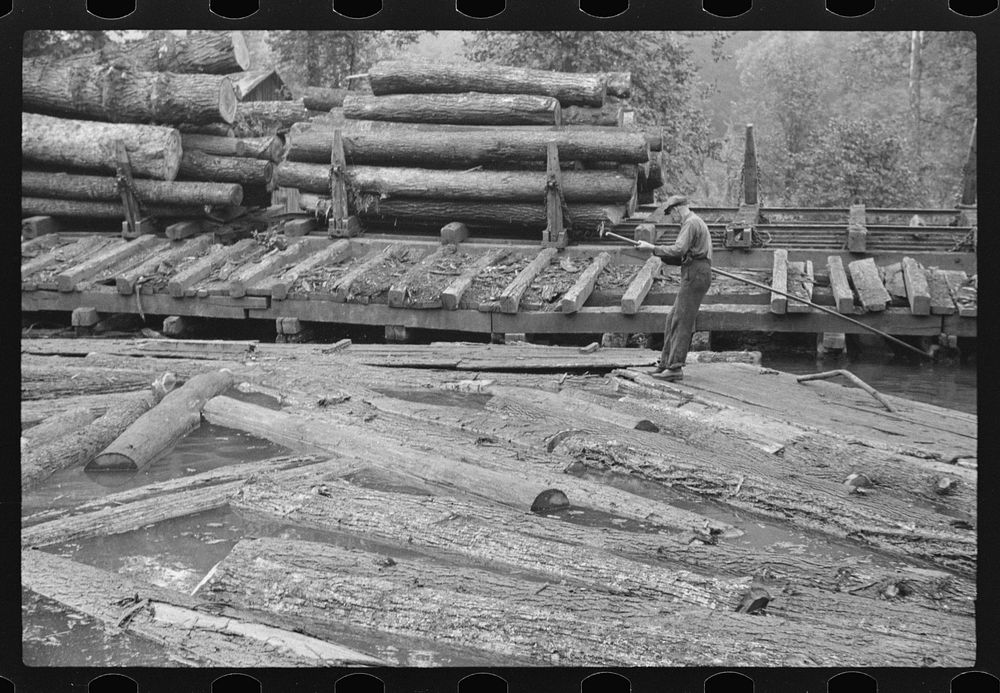 Pushing the logs toward the sawmill, Erwin, West Virginia. Sourced from the Library of Congress.