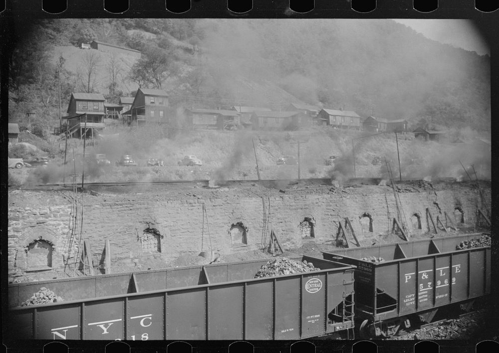 [Untitled photo, possibly related to: Coke ovens make heavy impenetrable smoke over whole town. Workers' homes in…