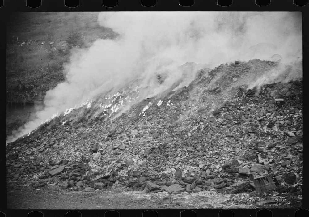 [Untitled photo, possibly related to: Burning slag near coal mine, Scotts Run, West Virginia]. Sourced from the Library of…