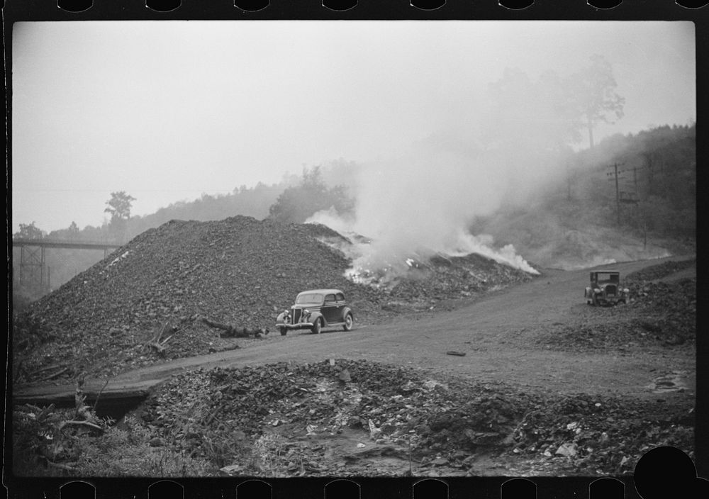 [Untitled photo, possibly related to: Burning slag near coal mine, Scotts Run, West Virginia]. Sourced from the Library of…
