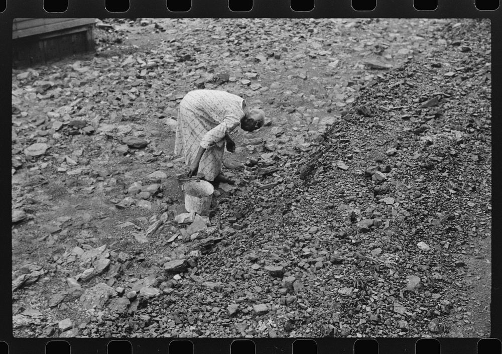 [Untitled photo, possibly related to:  woman picking up coal from old slate heaps in mining community. The "Patch,"…