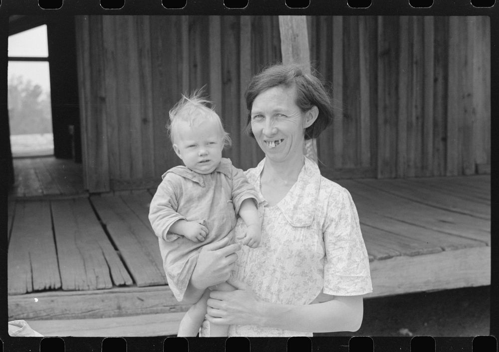 Mrs. Ellis Adkins and her youngest child. The family are rehabilitation borrowers. There are seven children and this is…